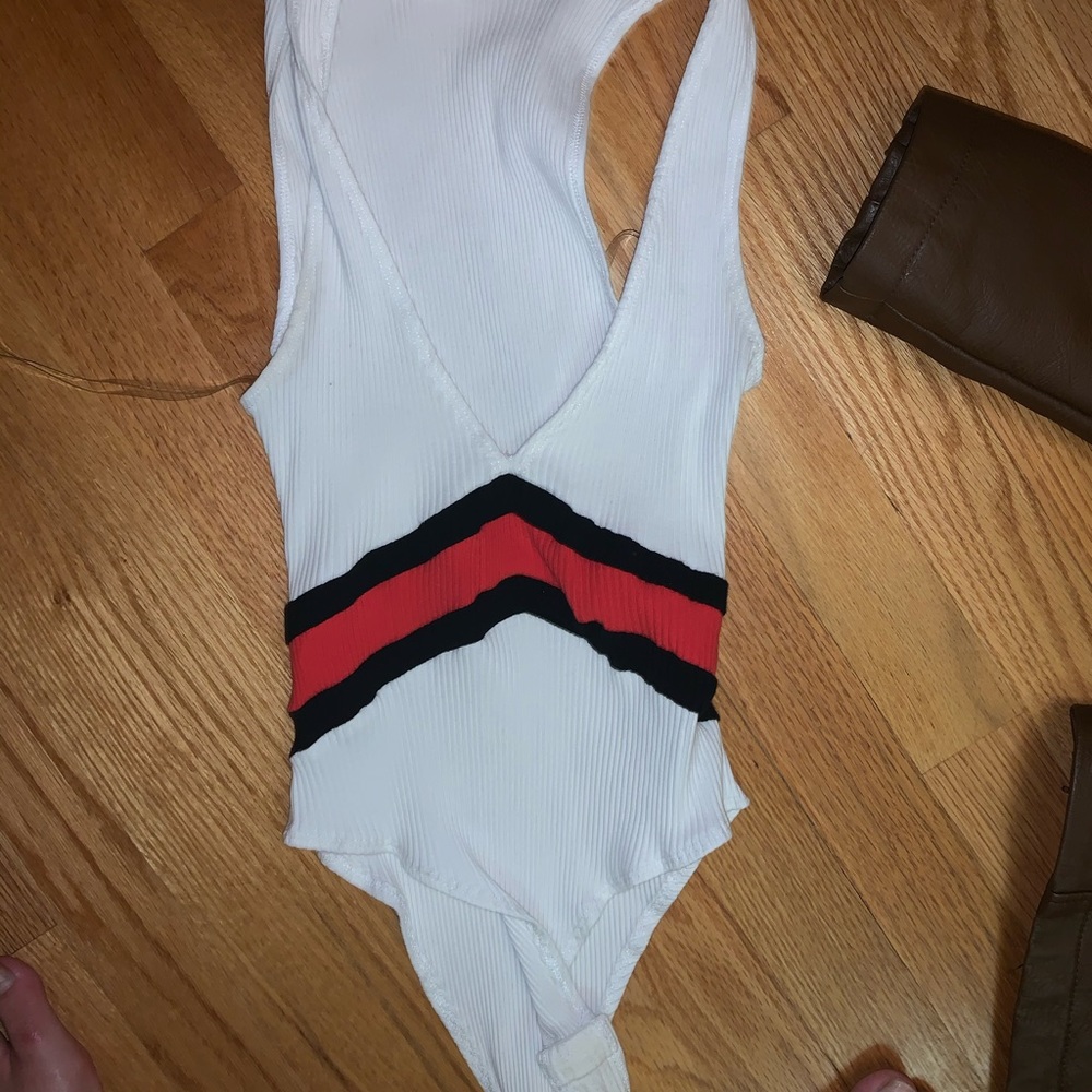 White, red, and black bodysuit